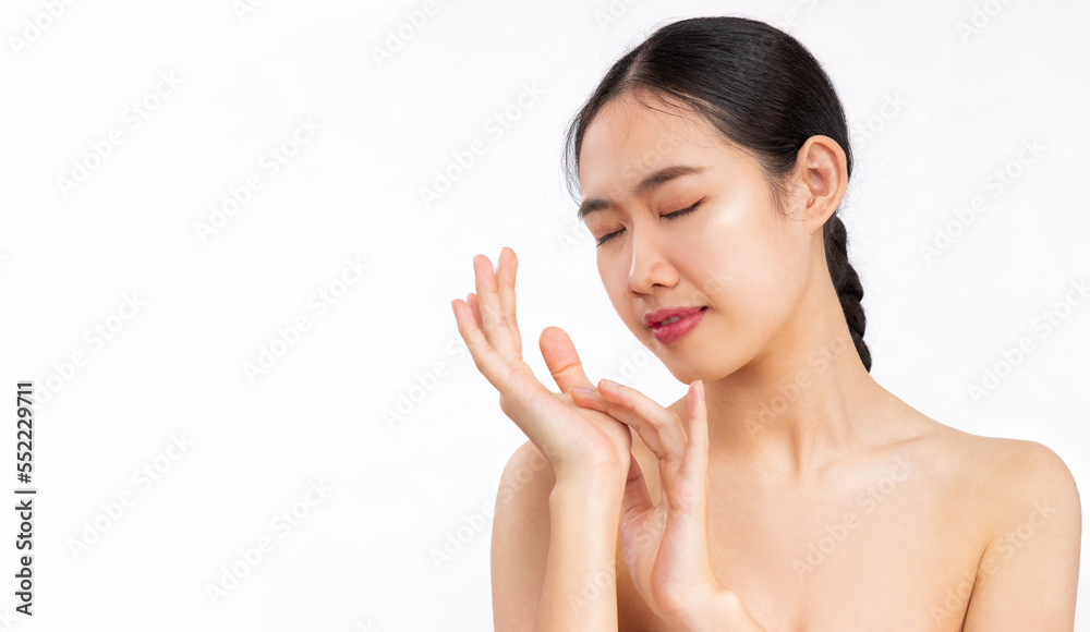 Young asian woman clean face, skin treatment on white background. Young asian woman clean face, skin treatment on white background.