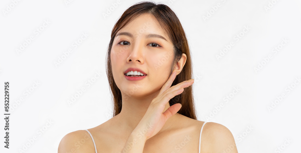 Young asian beautiful woman with clean fresh skin on white background posing hand touching on cheek face care facial treatment, beauty and spa. Asian girl clean face. Young asian beautiful woman with clean fresh skin on white background posing hand touching on cheek face care facial treatment, beauty and spa. Asian girl clean face.