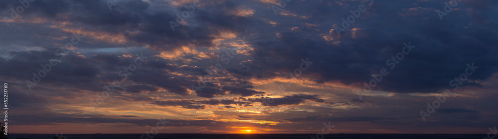 Landscape with bloody sunset. Panorama. Tragic gloomy sky. The last flashes of the sun on the storm clouds. Landscape with bloody sunset. Panorama. Tragic gloomy sky. The last flashes of the sun on the storm clouds.