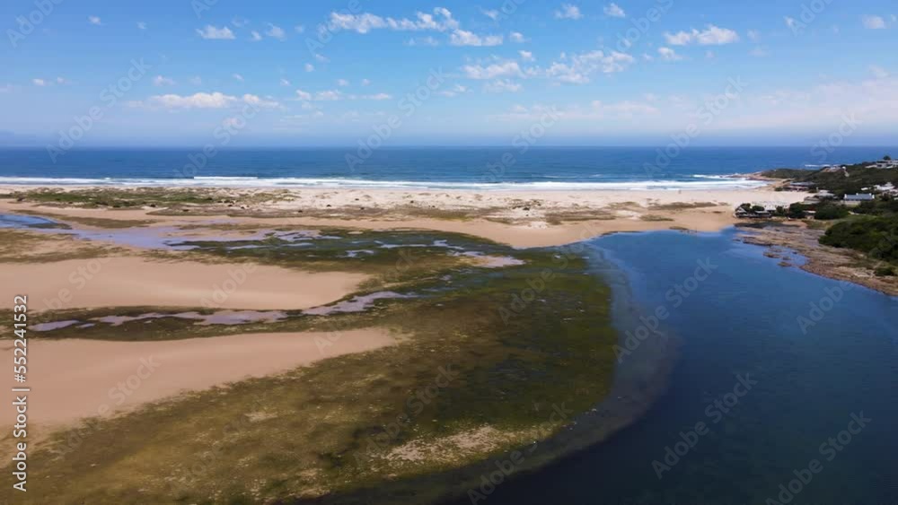 Drone pan reveals scenic lagoon environment in Plettenberg Bay, Garden Route Drone pan reveals scenic lagoon environment in Plettenberg Bay, Garden Route
