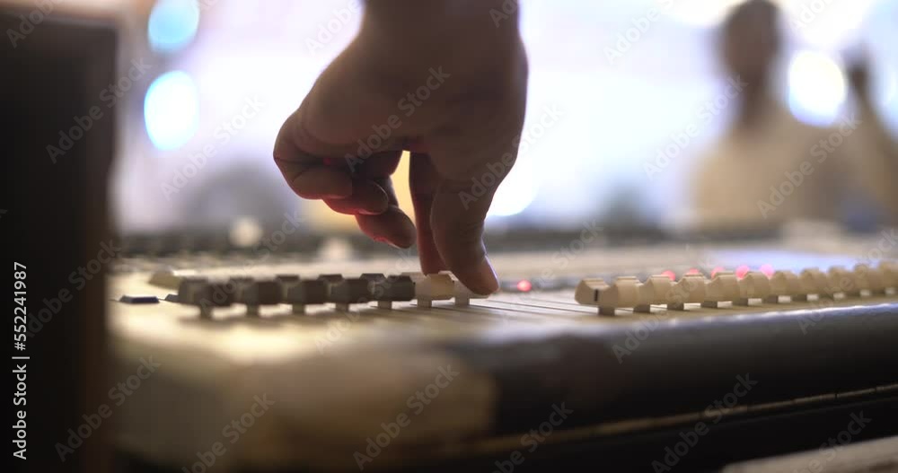 stage light control board dmx controller playing close up shot  blur background