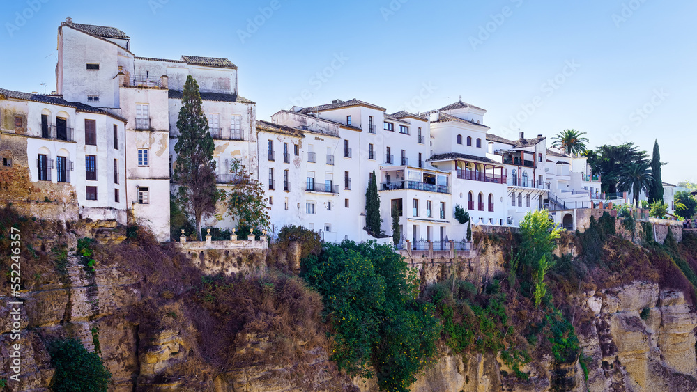 Houses hanging on the precipice of the gorge in the Andalusian village of Ronda, Malaga.