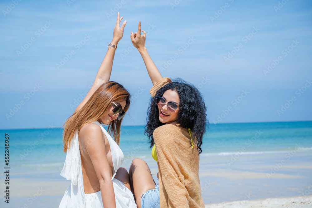 Beautiful girls and friend having fun together on the beach,Nice weather in travel and holiday concept. Beautiful girls and friend having fun together on the beach,Nice weather in travel and holiday concept.