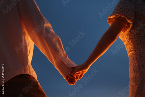 Couple holding hands under candlelight at sunset , Romantic © Zanta