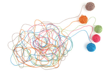 Tangled colorful cotton threads isolated on white background. Abstract thread lines chaos pattern.