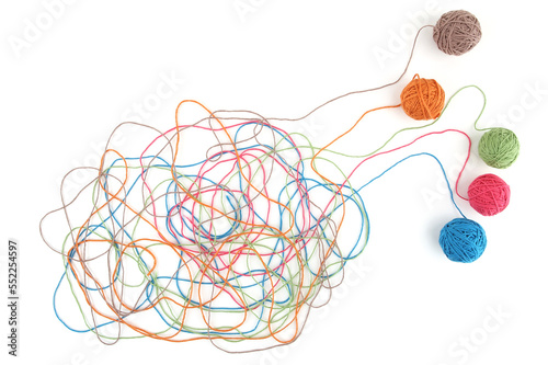 Tangled colorful cotton threads isolated on white background. Abstract thread lines chaos pattern. photo