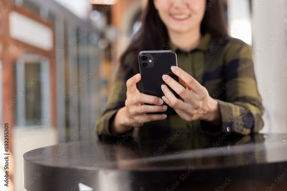 woman using cell phone hand holding mobile texting message contact us.chatting,search internet information in office.technology device communication connecting woman using cell phone hand holding mobile texting message contact us.chatting,search internet information in office.technology device communication connecting