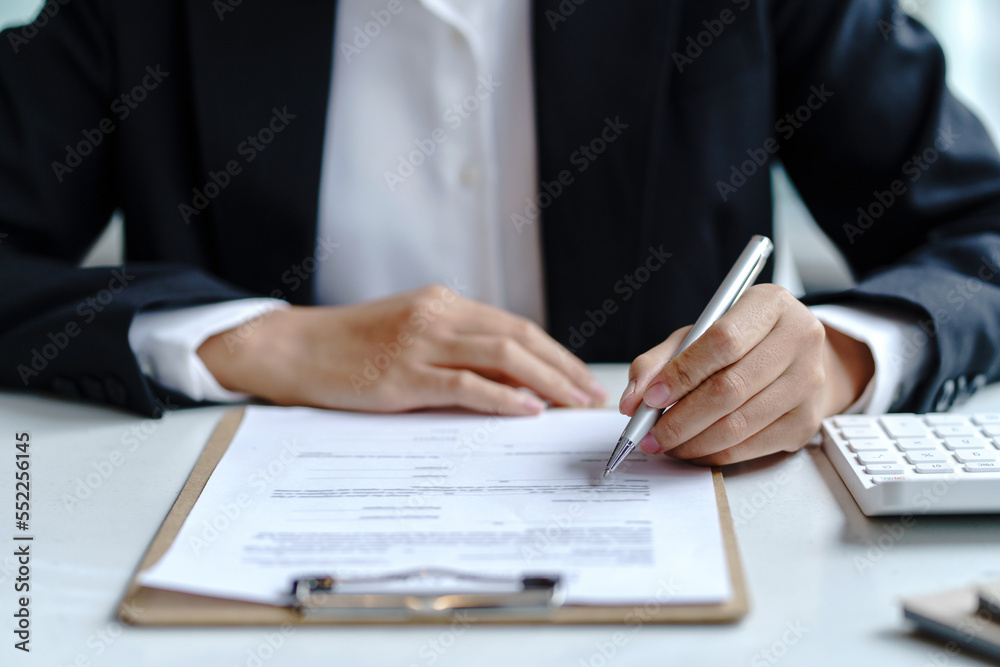 Businesswoman pointing at expense chart Budget management, income tax, financial statements, budgets, important financial document. Businesswoman pointing at expense chart Budget management, income tax, financial statements, budgets, important financial document.