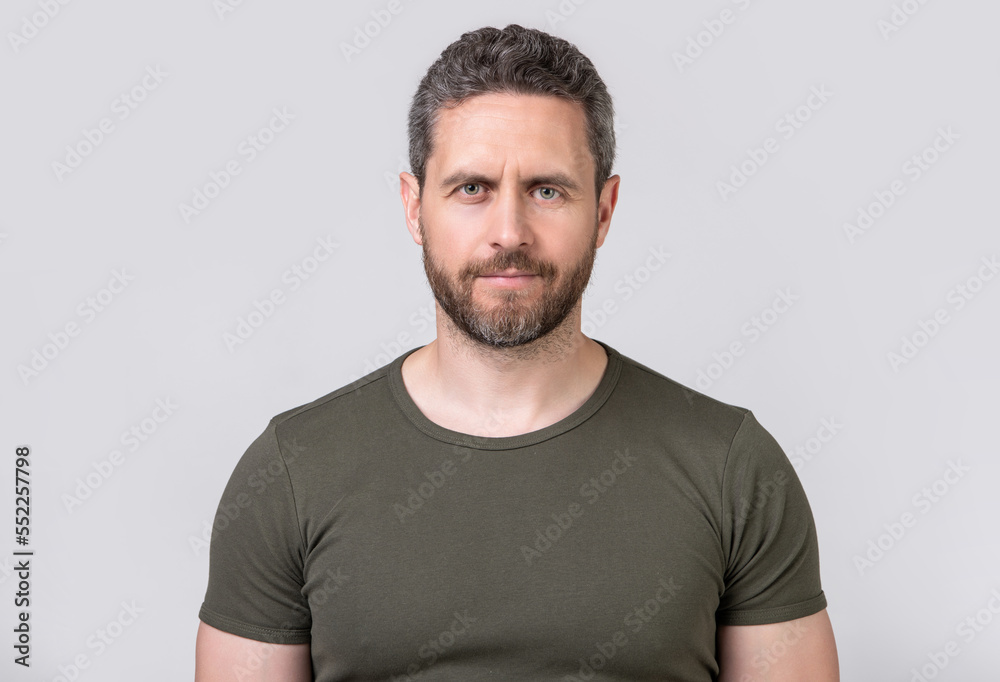 portrait of caucasian man with stubble isolated on grey background. caucasian man with stubble portrait of caucasian man with stubble isolated on grey background. caucasian man with stubble