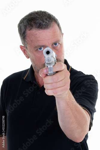 Brave man points his revolver gun with handgun on white background © OceanProd