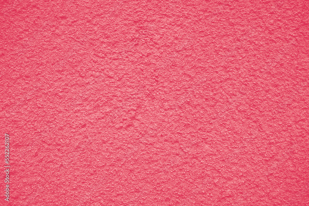Fototapeta premium Background of peeling Magenta paint on an old textured wall. Color Of The Year 2023 - Viva Magenta.