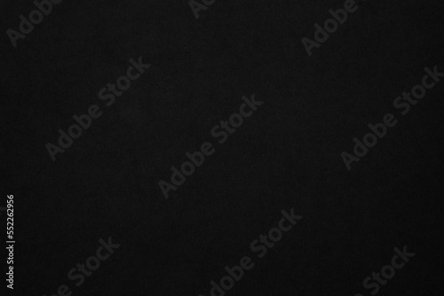 Black paper texture background. Black blank cardboard sheet page. Old vintage page dark grunge vignette. 