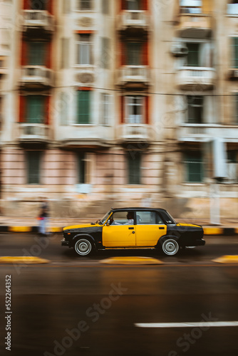 Blurred motion picture of yellow cab on city street