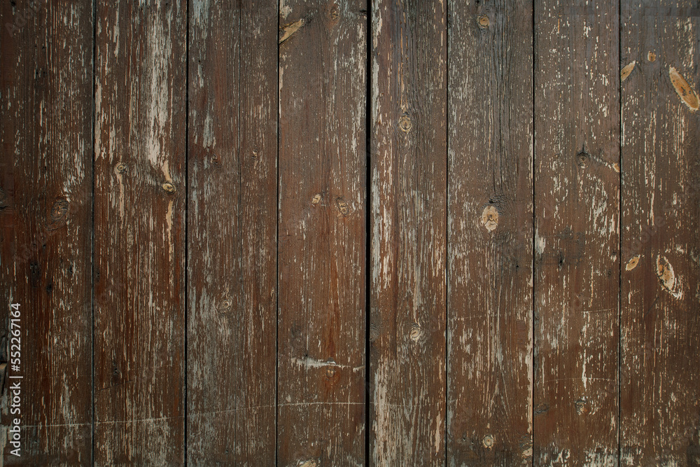 Naklejka premium Old brown wooden background. Timber texture