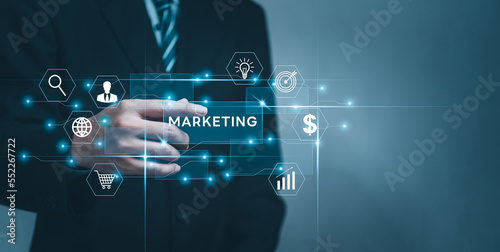 Businessman holding digital marketing in hand with icon network connection technology and shopping online virtual screen.