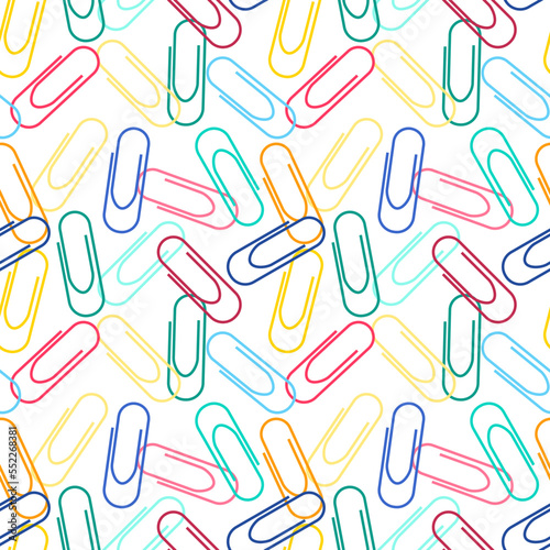 Repeat pattern office related items Color paper clips on white background