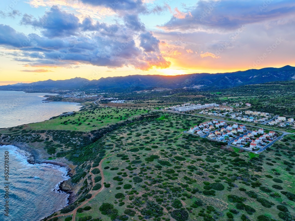 Sunrise with green field which is land for real estate in Esentepe, North Cyprus