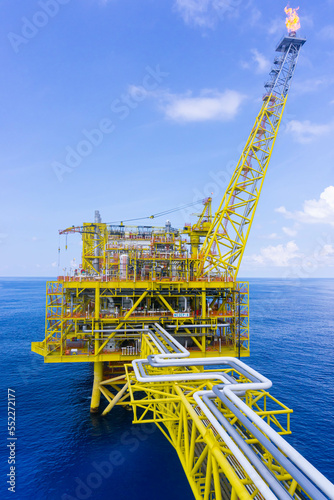 Oil drilling rig with the flair boom.