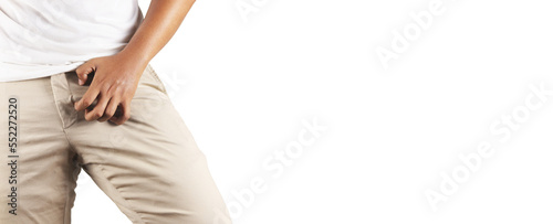 Obraz na plátne Asian man in reaction of scratching crotch on white background, closeup