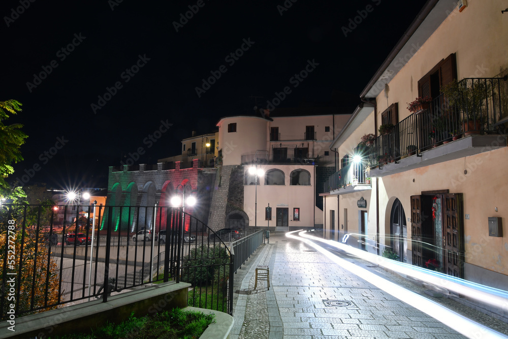 Obraz premium Light trails in the night in a street of Ruviano, a small village in the province of Caserta in Italy.