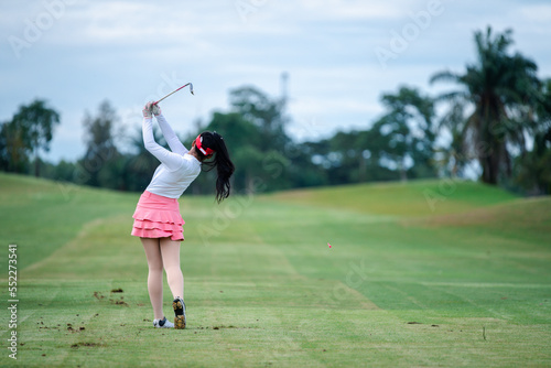 Wallpaper Mural 	
Professional woman golfer teeing golf in golf tournament competition at golf course for winner.	
 Torontodigital.ca