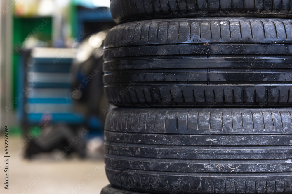 Set of summer tires of the car in the car service, transport concept Set of summer tires of the car in the car service, transport concept