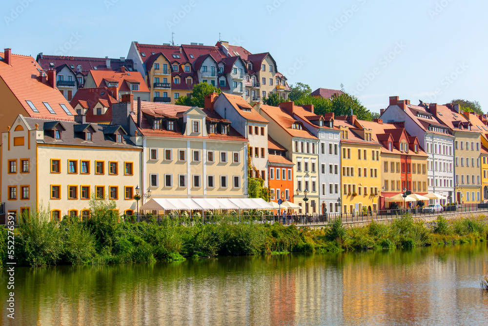 Colorful tenement houses on the Nysa Luzycka River, on the border between Poland and Germany, Zgorzelec, Poland