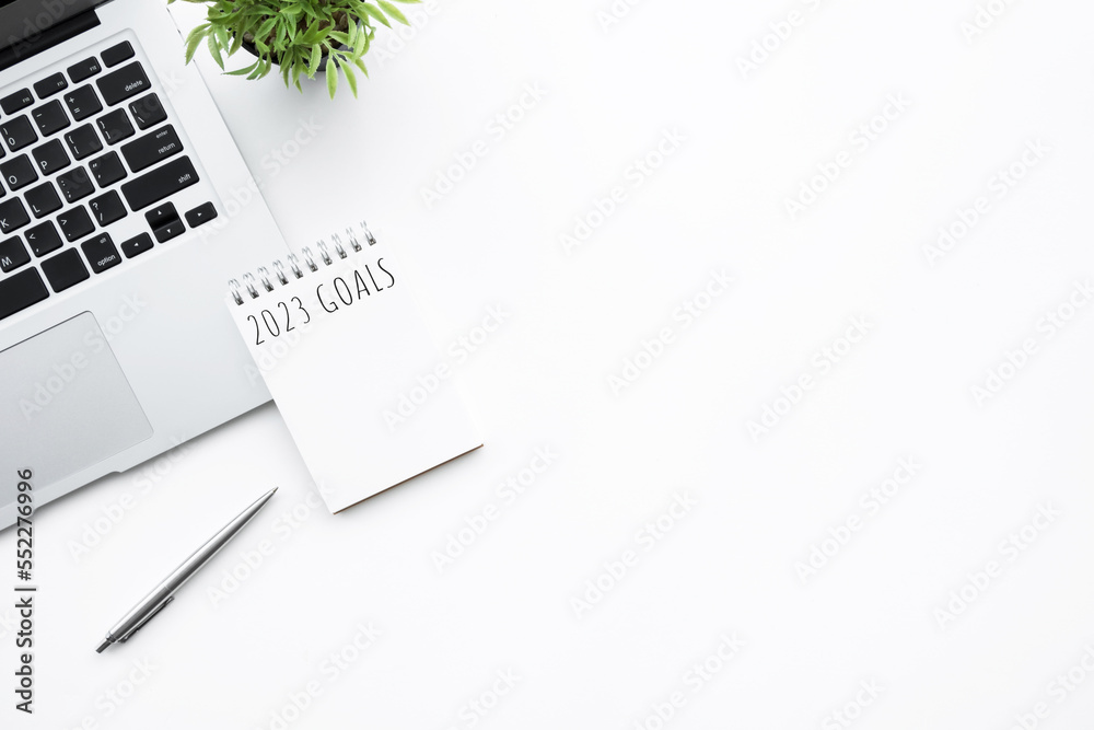 Notebook with 2023 goals text on it to apply new year resolutions and plan. Notebook with 2023 goals text on it to apply new year resolutions and plan.