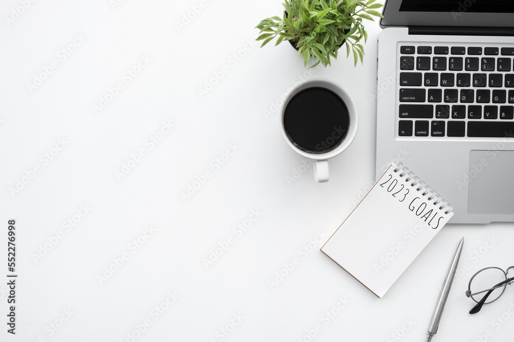 Notebook with 2023 goals text on it to apply new year resolutions and plan.