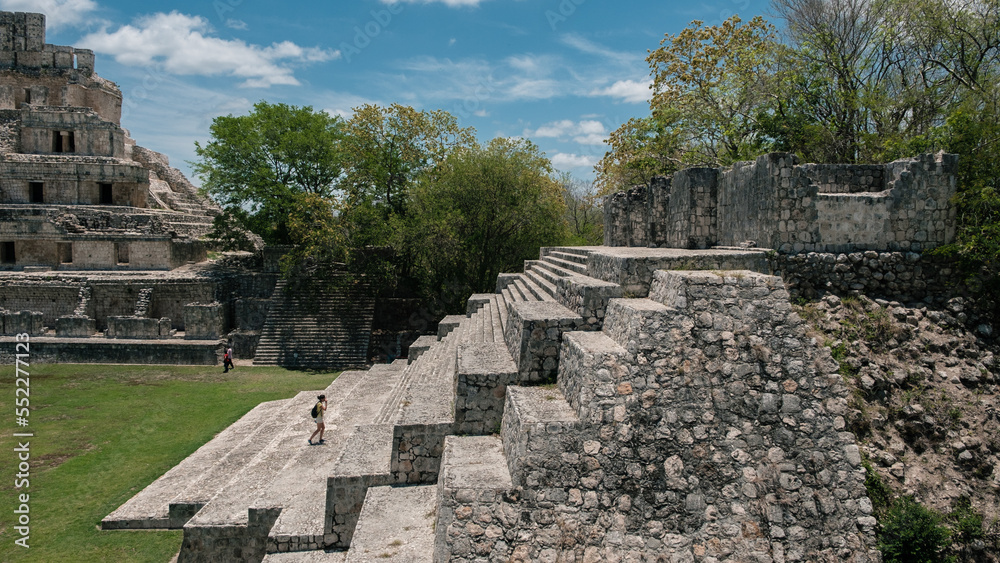 Woman climbing the ruins of the mayas pyramids at Edzna, Yucatan Woman climbing the ruins of the mayas pyramids at Edzna, Yucatan