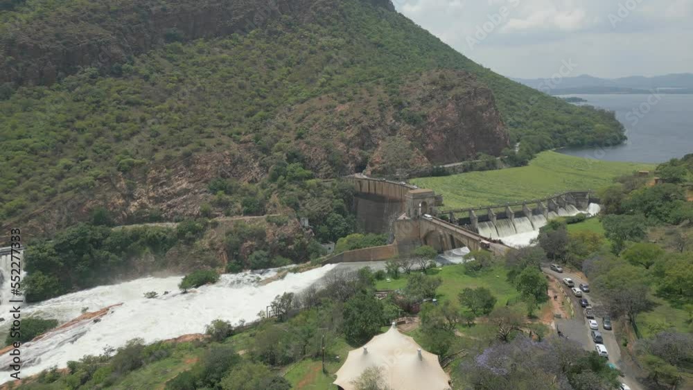 Traffic waits to cross bridge across Hartbeespoort Dam wall. Aerial
