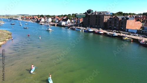 Aerial view of a protected harbour with yachts and paddle boarders at Wells-next-the-Sea, Norfolk, UK. photo