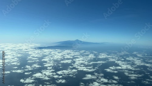 Aerial view from a jet cockpit of Tenerife Island and the Teide volcano during the descent for the approach in a splendid and sunny winter moorning. photo