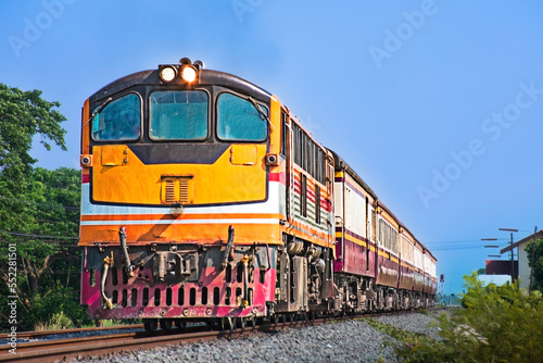 Passenger train by diesel locomotive on the railway.