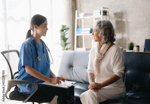 Doctor and patient discussing something while sitting at the table . Medicine and health care concept.