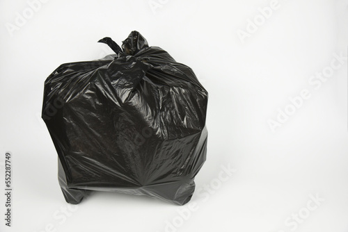 plastic bottles in black garbage bag isolated on white background .plastic bottles in black garbage bag  for recycling