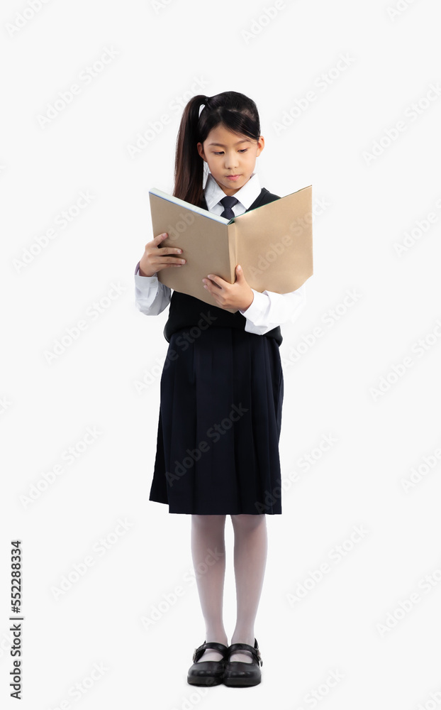 Asian student in school uniform standing full length and reading book on white background. Asian student in school uniform standing full length and reading book on white background.