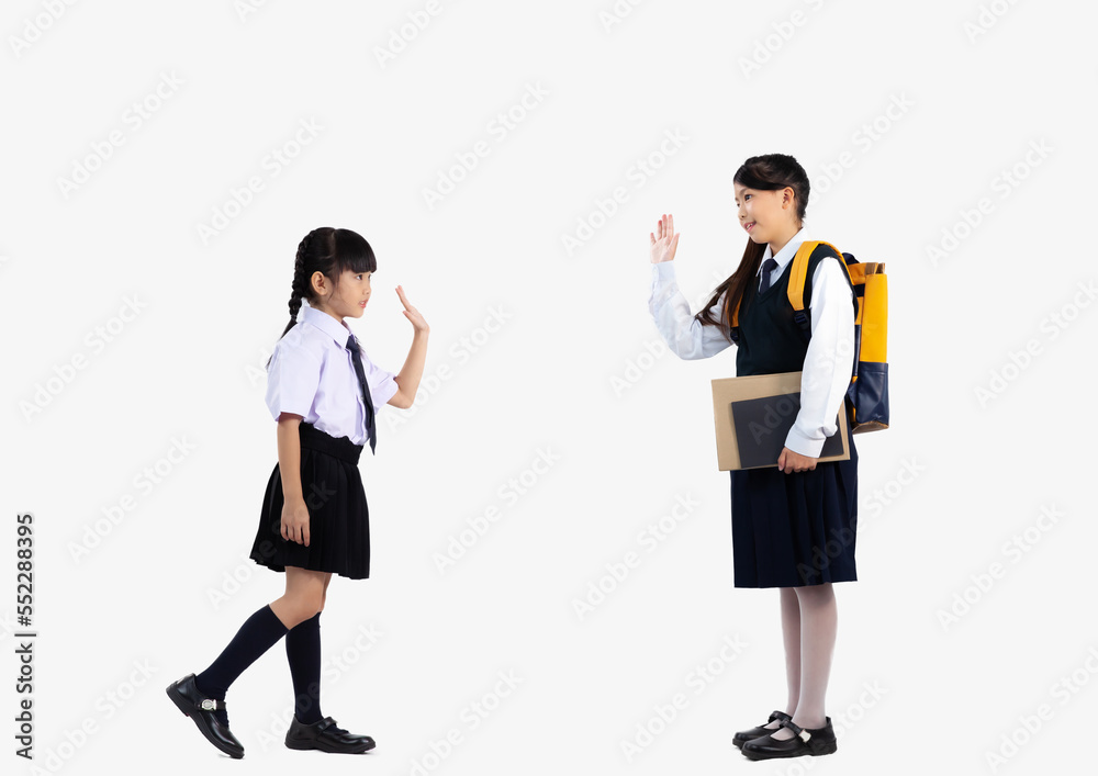 Asian kids in school uniform posing on white background full length. Asian kids in school uniform posing on white background full length.