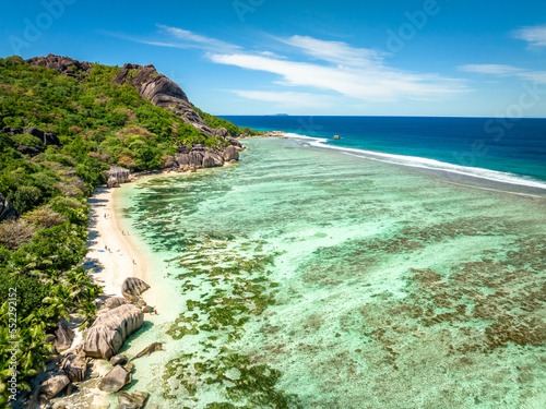 Fototapeta Naklejka Na Ścianę i Meble -  Aerial view of Anse Source d'Argent, La Digue Seychelles. Picturesque paradise beach. granite rocks,white sand,palm trees,turquoise water