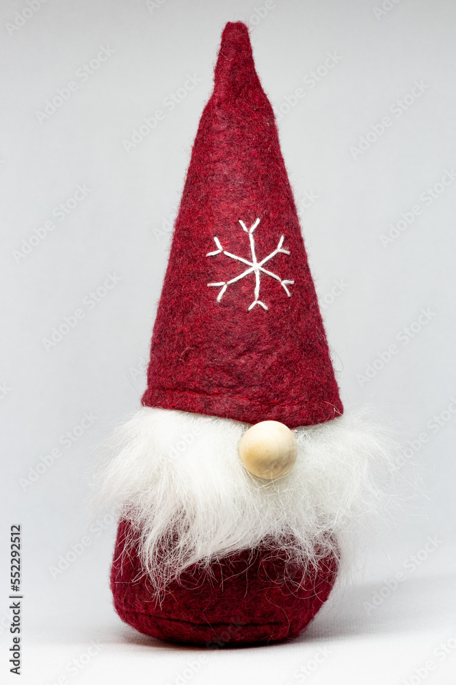 Funny cute Christmas gnome in red with a snowflake on the cap Funny cute Christmas gnome in red with a snowflake on the cap