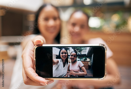 Phone, friends and woman with selfie on screen enjoying shopping, quality time and weekend at the mall. Friendship, social media and happy girls taking picture for memories on holiday on smartphone