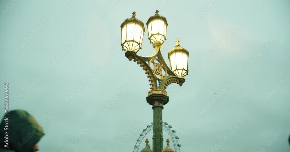 Street Lamp in London with London eye behind Street Lamp in London with London eye behind