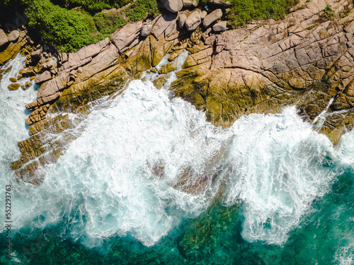 Aerial view Top down seashore. Waves crashing on rock cliff. Beautiful dark sea surface in sunny day summer background Amazing seascape top view seacoast at La Dique Grand l'Anse, Seychelles