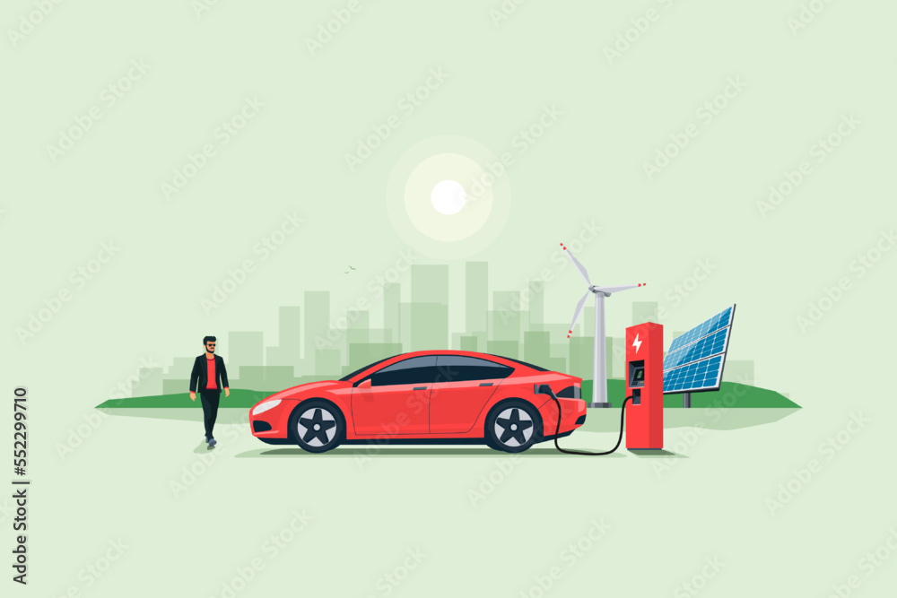 Naklejka premium Flat vector illustration of a red electric car charging at the charger stand on the street with green city skyline in the background. Renewable electricity energy solar and wind power station.