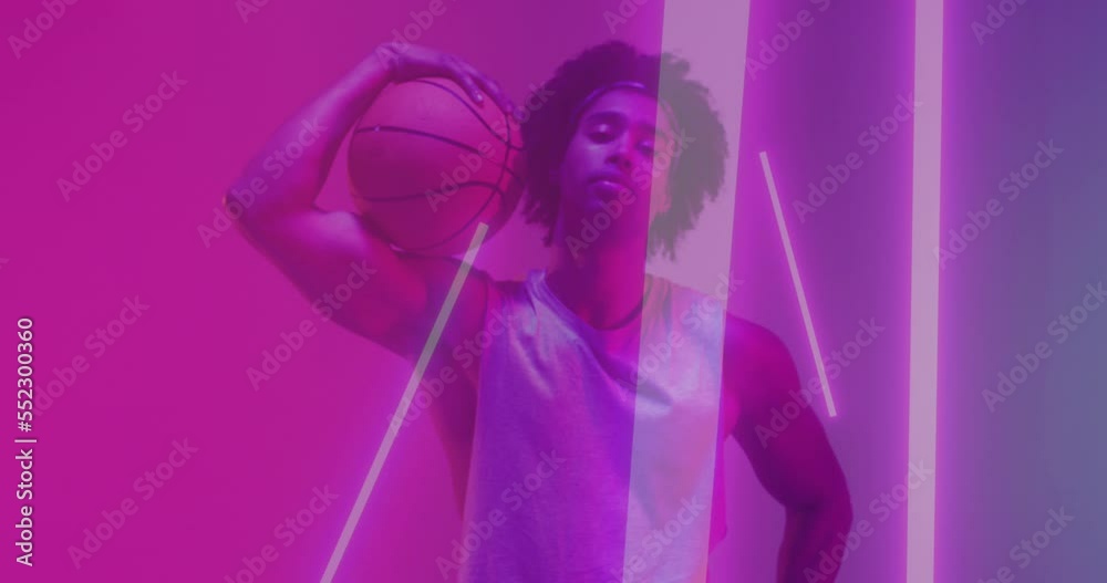 Animation of confetti and neon pattern and biracial basketball player Animation of confetti and neon pattern and biracial basketball player
