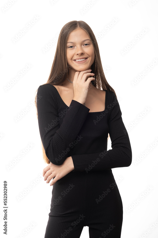 Pretty teenage girl with long hairs in black clothes on isolated white background. Pretty teenage girl with long hairs in black clothes on isolated white background.