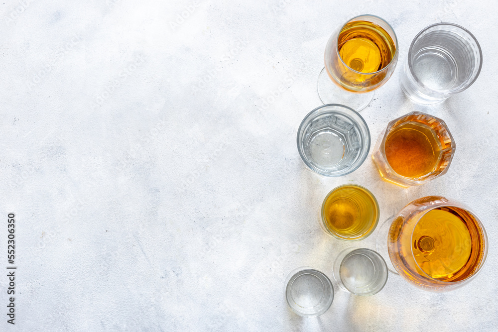 Strong alcohol set. Hard alcoholic drinks in glasses in assortment