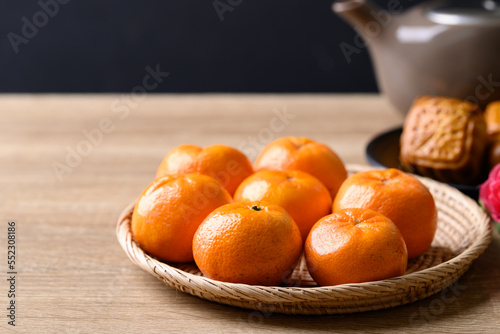 Mandarin orange fruit and Chinese mooncake celebrating in Chinese festival mid autumn or new year
