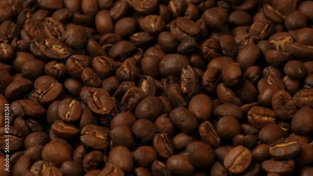 Slow motion of roasted coffee beans falling. Organic coffee seeds. Slow motion of roasted coffee beans falling. Organic coffee seeds.