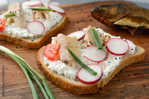 Sandwich with cottage cheese and smoked trout for breakfast